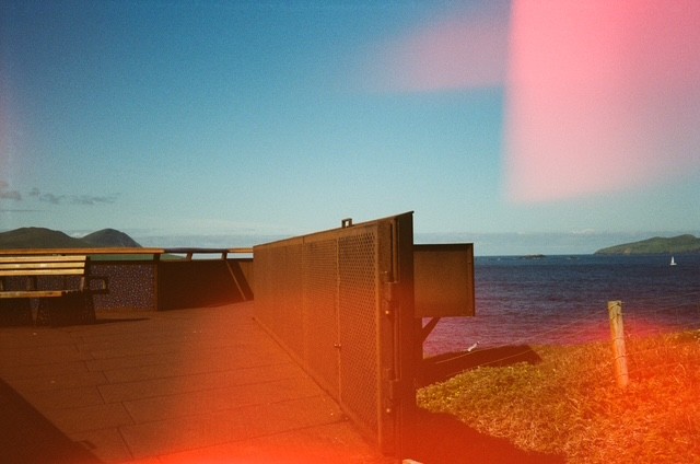 sneaky sailboat, film photograph by Robert Corrigan